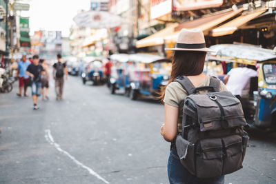 Rear view of woman on city street