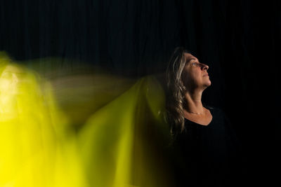 Time lapse view of woman moving a rag. long exposure, motion blur. 