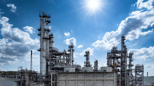 Oil and gas refinery plant and storage tank form industry zone with blu sky background, oil and gas