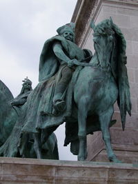 Low angle view of statue against sky