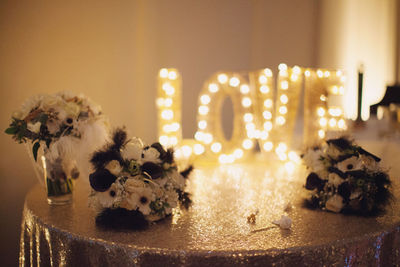 Close-up of illuminated christmas tree on table