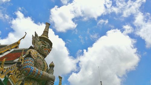 Low angle view of statue against cloudy sky