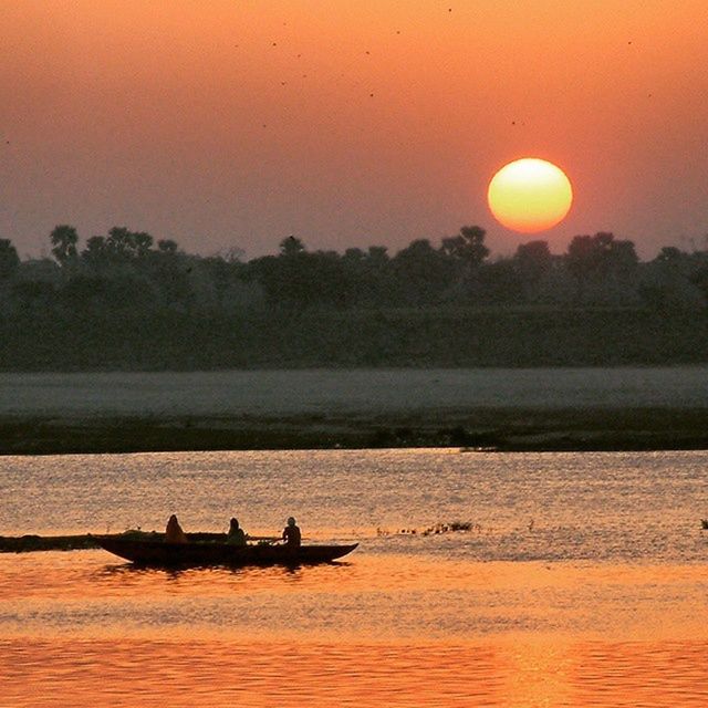 sunset, transportation, nautical vessel, water, mode of transport, silhouette, boat, waterfront, orange color, scenics, sun, tranquil scene, tranquility, nature, sailing, beauty in nature, sky, river, sea, lake