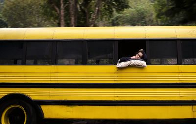 Woman sleeping on bus window