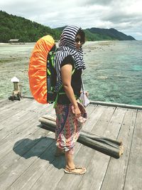 Woman standing on beach