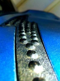 Close-up of blue car