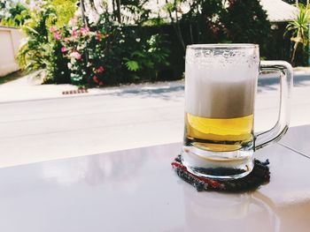 Close-up of beer glass on table