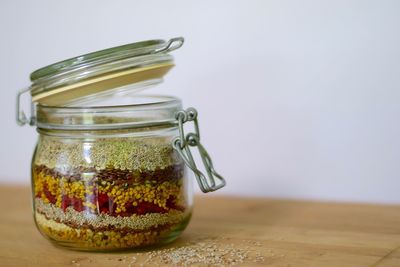 Close-up of drink in jar against white background