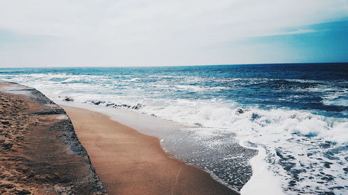 Scenic view of beach against sky