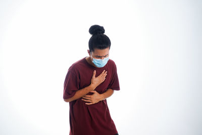 Full length of man standing against white background