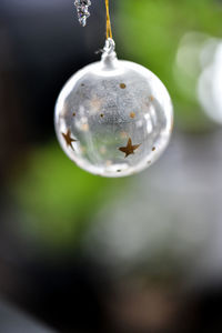 Christmas ornaments hanging from the tree