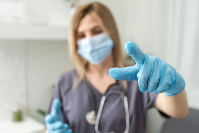 Portrait of young woman using mobile phone