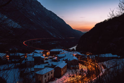 Aerial view of townscape against sky during winter