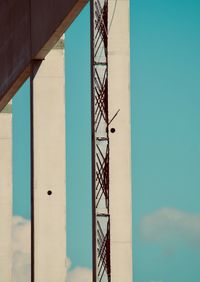 Low angle view of modern building against blue sky