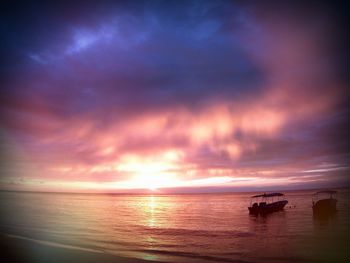 Scenic view of sea against cloudy sky