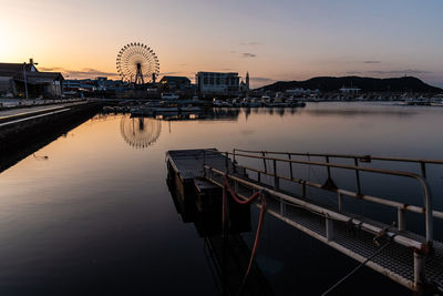 Harbour and ferris wheel at the sunset