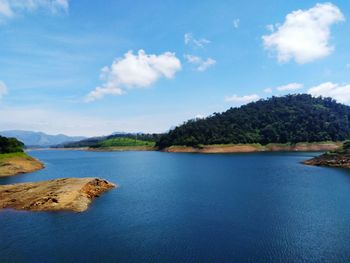 View of calm lake against mountain range