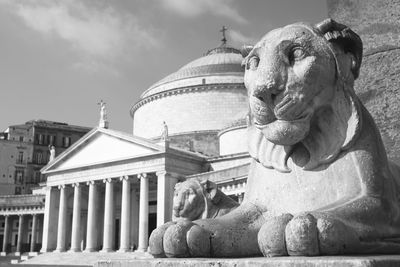 Lion statue in san francesco di paola, piazza del plebiscito, naples, italy