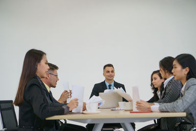 Group of people working on table