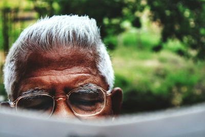 Cropped image of senior man wearing eyeglasses