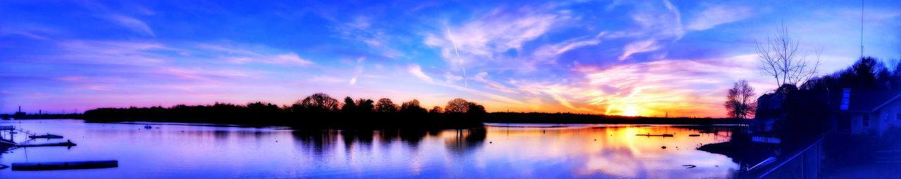 Scenic view of calm lake at sunset