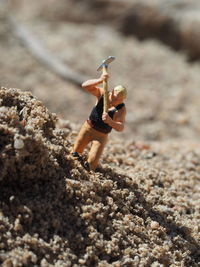 Low angle view of man on rocks at beach