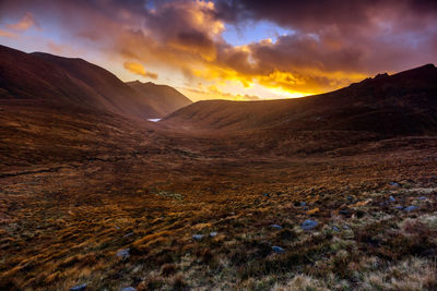 Scenic view of mountains against sky during sunset