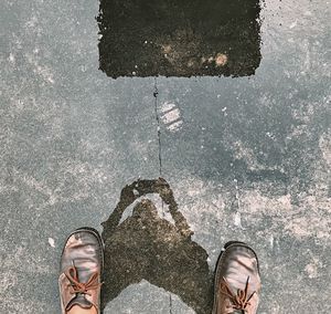 Low section of person in puddle