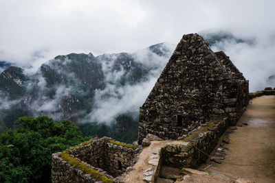 View of old building against cloudy sky