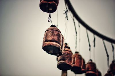 Low angle view of hanging against sky