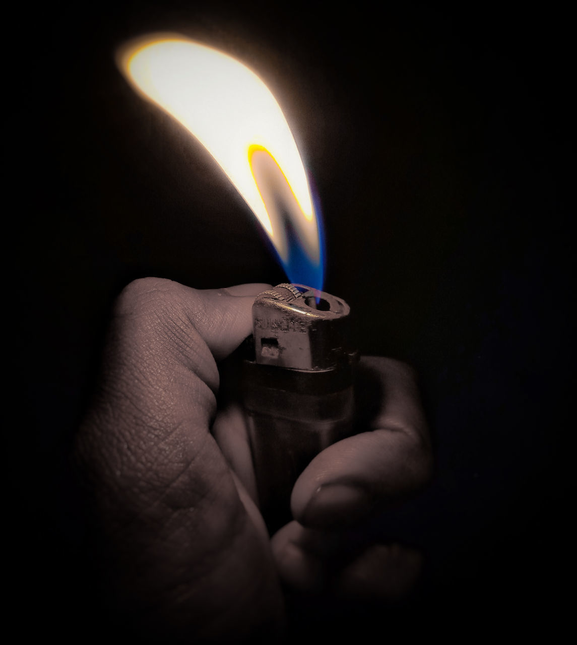 burning, fire, flame, hand, darkness, light, heat, holding, finger, indoors, close-up, igniting, black background, one person, candle, glowing, studio shot, illuminated, lighting, cigarette lighter, white, black, dark, single object, lighting equipment, adult