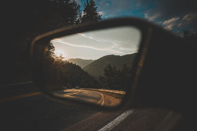 Reflection of car on side-view mirror