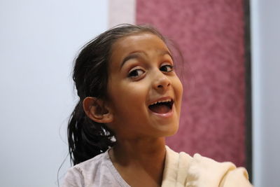 Portrait of a smiling young woman looking away