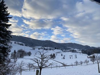 Scenic view of snowcapped mountains against sky