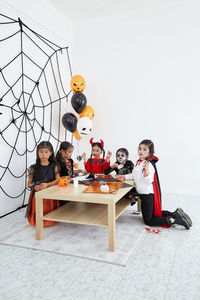 High angle view of people sitting on floor