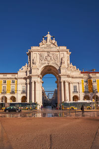 Low angle view of historical building against clear blue sky