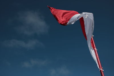 Low angle view of flag against sky