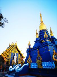 Low angle view of temple against building