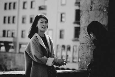 Young woman standing in city