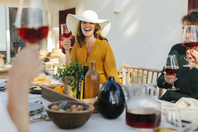 Happy woman holding wineglass