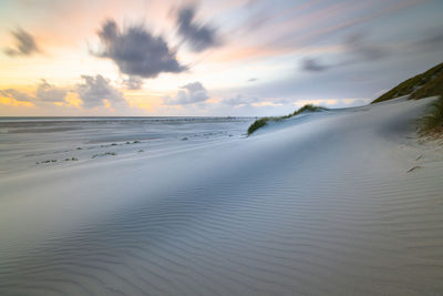 Colorful sunset over the north sea with drifting clouds on amrum island germany