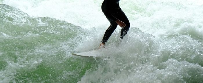 Man splashing water in sea