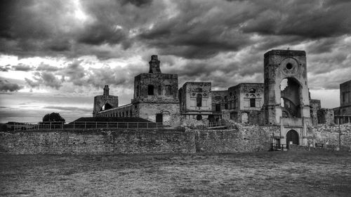 Old ruin building against cloudy sky