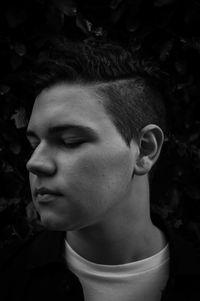 Close-up portrait of boy looking away