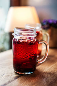 Close-up of drink in jar on table