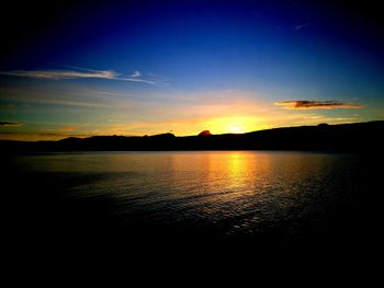 Silhouette of lake at sunset