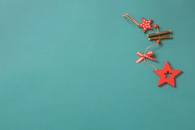 High angle view of christmas decorations against blue background