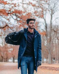 Full length of young man standing in park