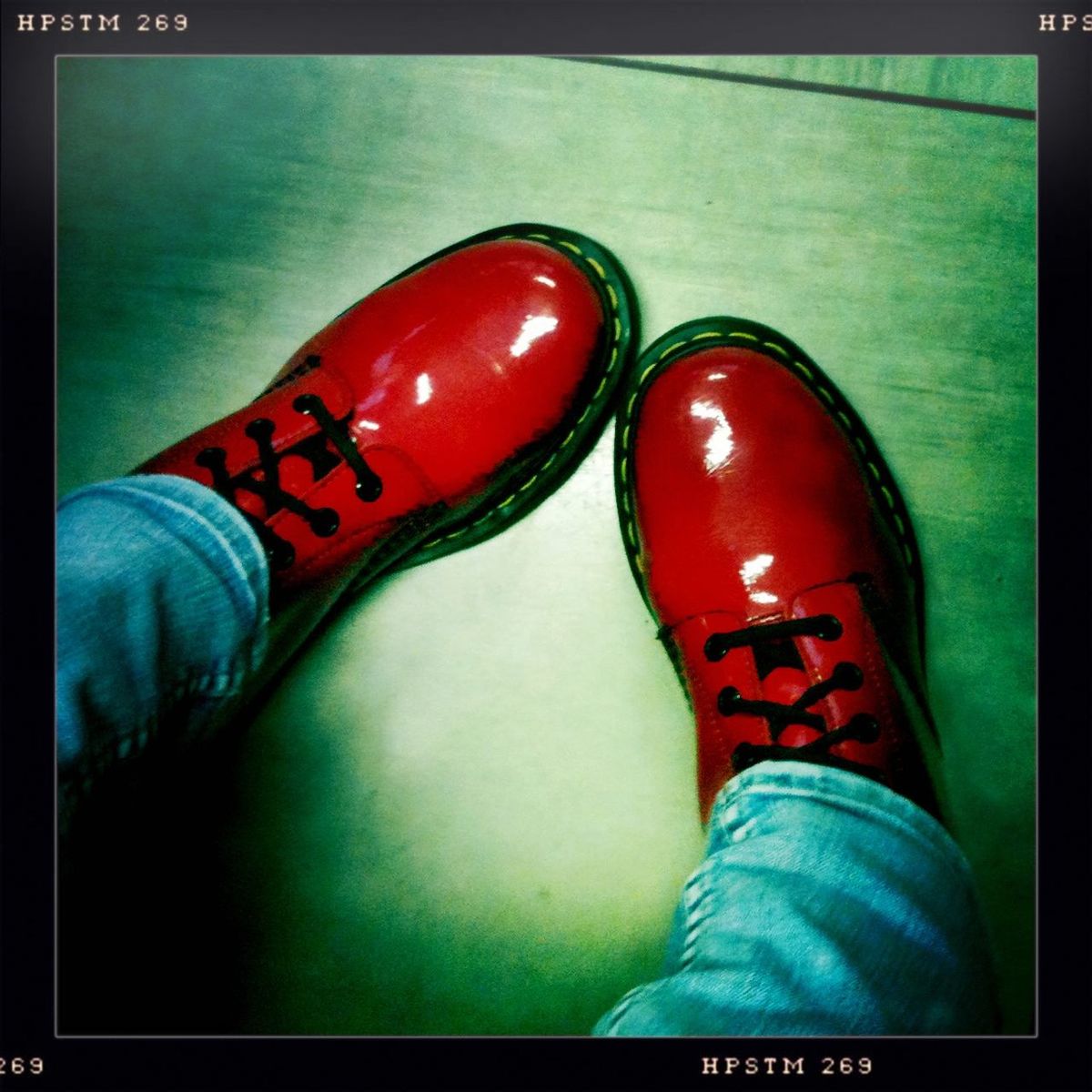 low section, person, shoe, transfer print, personal perspective, footwear, human foot, auto post production filter, canvas shoe, red, jeans, pair, standing, indoors, high angle view, lifestyles, close-up