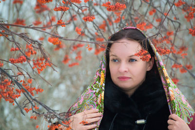 Close-up of woman wearing scarf at park